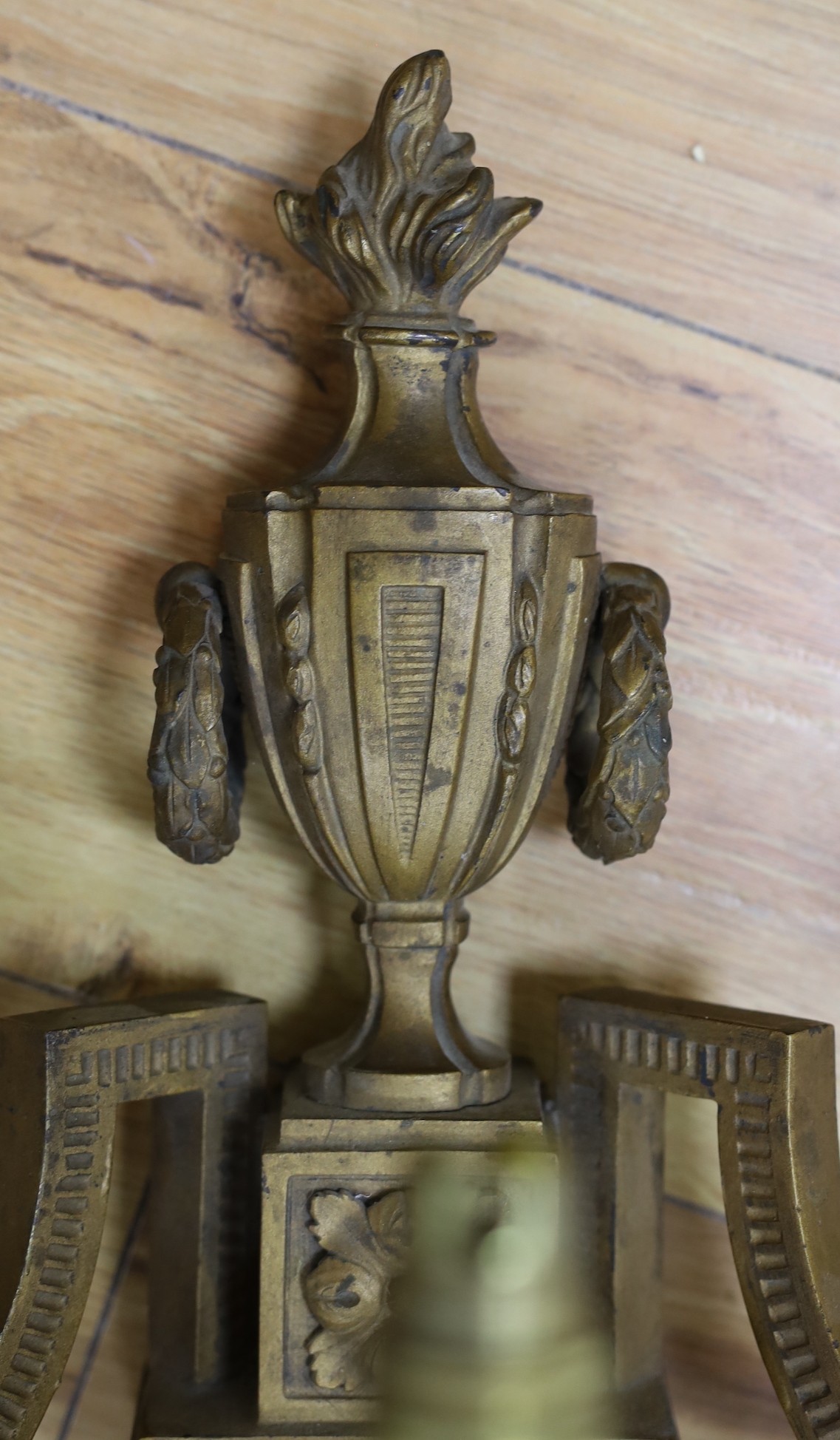 A contemporary bronze three branch wall sconce, 64cm